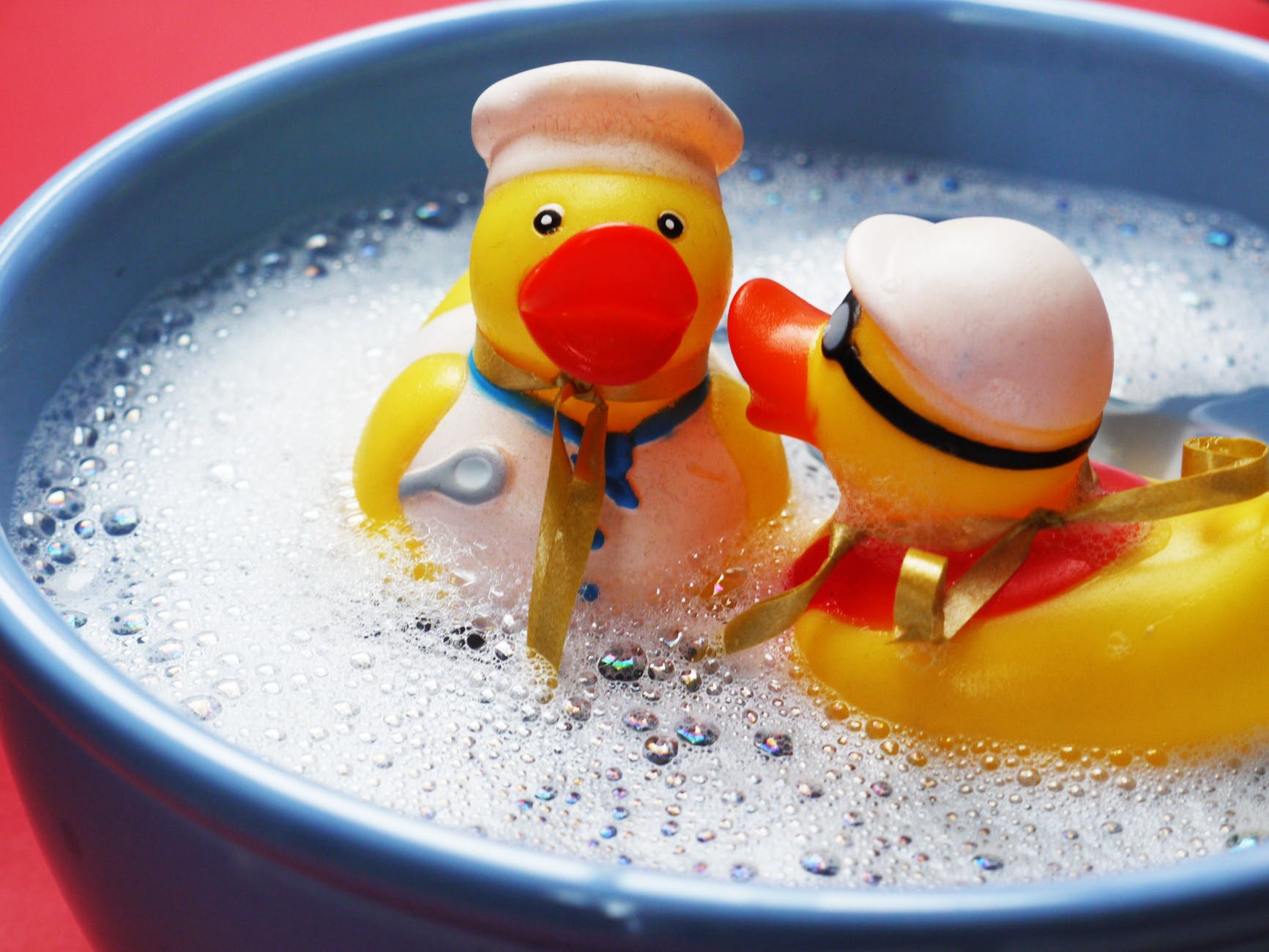 two rubber ducks on water